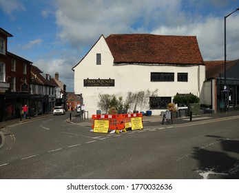 St Albans England UK 3/07/2020 Yellow Road Traffic Management Signs To Promote Social Distancing In Streets With Narrow Pavements To Promote Safe Shopping During The Covid 19 Pandemic