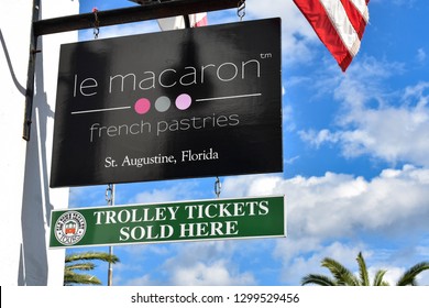 St. Augustine, Florida. January 26 , 2019. Le Macaron Pastries An Trolley Tickets Signs At Old Town In  Florida's Historic Coast .