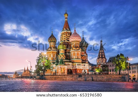 St. Basil's Cathedral in Moscow on Red Square on a summer evening and a blue cloud