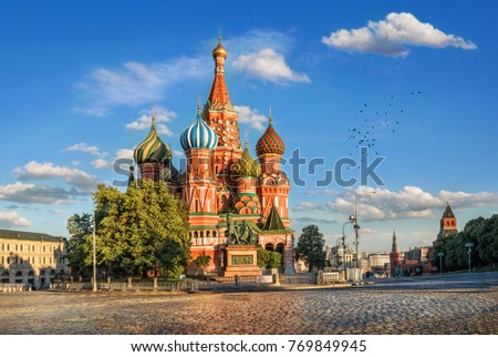 St. Basil's Cathedral on Red Square in the Kremlin in Moscow in the light of the evening sun and clouds in the blue sky