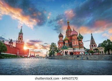 St. Basil's Cathedral And The Spasskaya Tower Of The Moscow Kremlin And The Summer Sunset With Colorful Clouds