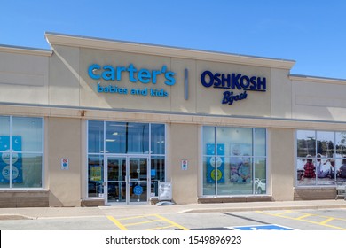 A Logo Sign Outside Of A Carter's, And OshKosh B'gosh, 52% OFF