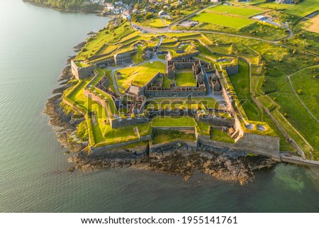 St. Charles Fort Kinsale Cork Ireland, amazing aerial scenery view on coast line and old Irish touristic landmark town at sunset 