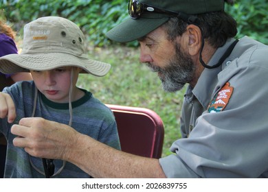 St. Croix National Scenic River, WI, USA-circa July 2015 – Family Fun Day Includes Fly Tying Lessons From A Park Ranger As Part Of The Healthy Parks, Healthy People Initiative, Getting Kids Outside 