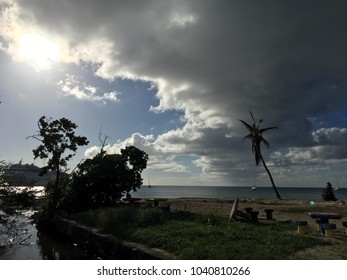 St. Croix, U. S. Virgin Islands – November 22, 2017: Marring This Tropical Paradise View Is Only The Overturned Stone Table And The Distant, Stationary Cruise Ship Housing Hurricane Relief Workers.