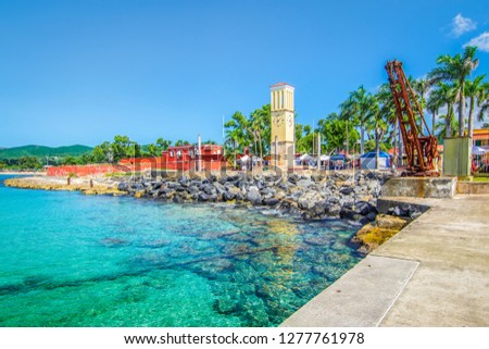 St Croix, Virgin Islands, Caribbean. Frederiksted cruise port with old Fort Frederik and clock tower at the waterfront.