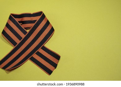 The St. George Ribbon Is A Symbol Of Russian Military Valor. On A Yellow Background