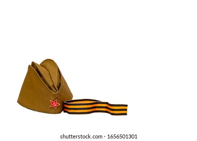 St. George's ribbon and cap of a Soviet soldier isolated on a white background. May 9, Victory Day. Flat lay, copy space. - Shutterstock ID 1656501301