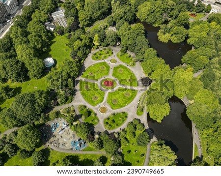 St Stephen’s Green Park, Dublin, Ireland. The lush greenery, serene lake, and historic monuments of the park are beautifully captured from above, providing a unique perspective of this urban oasis