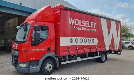 St Helens, Merseyside, UK. 08 12 2021 DAF LF 180 In Red With The Company Wolseley Livery Outside Of A Warehouse Unit On An Industrial Park.