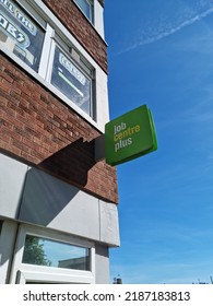 St Helens Merseyside UK 08 06 22 Job Centre Plus Green Square Sign Attached To The Outside Wall Of The Government Department Office Building With Copy Space.