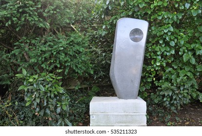 ST IVES, UK - DECEMBER 2, 2016. Poised Form Is A 1951-52 Purbeck Marble Sculpture By Barbara Hepworth (1903-1975) On Premanent Display In Her Trewyn Studio Garden At St Ives, Cornwall, UK.