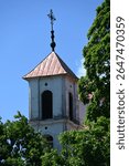 St. James the Apostle Church tower among the trees, Punia, Lithuania