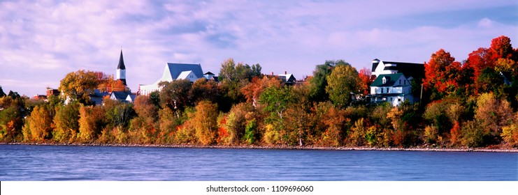 The St. John River flows past Woodstock New Brunswick on an Autumn morning.