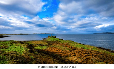 St John s Point in Donegal at the west coast of Ireland - A beautifully serene coastal landscape featuring a historic ruin, calm waters, and lush greenery all around it - Powered by Shutterstock