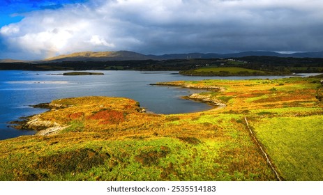 St John s Point in Donegal at the west coast of Ireland - A beautifully serene coastal landscape featuring a historic ruin, calm waters, and lush greenery all around it - Powered by Shutterstock