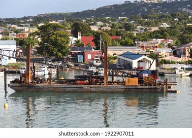 St John's, Antigua And Barbuda - November 24th 2019: Industrial Crane Barge At Dock In The Port Of St John, In The Caribbean West Indies