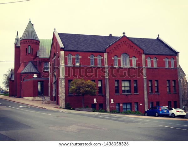 St. John\'s, Newfoundland, Canada / June 7, 2019:\
Beautiful colorful buildings. Its name attributed to the Nativity\
of John the Baptist, when John Cabot was believed to have sailed\
into the harbor.