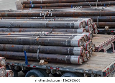 St. John's, Newfoundland/Canada - April 2019: Drilling Risers, A Vertical Pipe Used In Offshore Oil Operations Sits On A Platform.The Drill Stack Of Drill Pipe Are Used For Drilling Mud In Oil And Gas