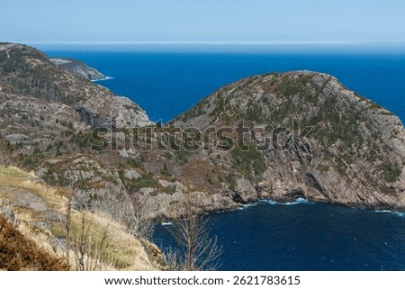 St. John's, NL, Canada. Cuckholds Head, North Head Trail on the east coast of Newfoundland. On a sunny day, the sea and sky of the Atlantic Ocean are the same color.