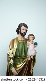 St Joseph Holding The Christ Child Statue Isolated
