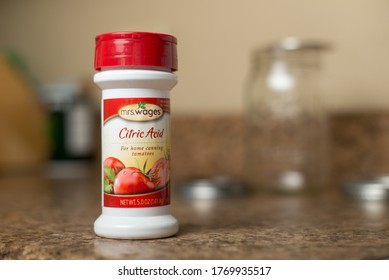 St. Joseph, MO / United States Of America - May 9th, 2020 : Mrs. Wages Brand Citric Acid, Bottle On Kitchen Counter Top With Mason Jar Canning Supplies In Background.  Grocery Item At Home.