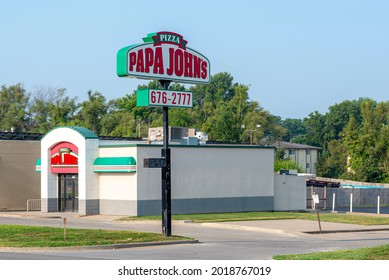 St. Joseph, MO United States Of America - August 2nd, 2021 : Papa John's Store Exterior And Parking Lot, With Large Street Sign.  Popular Fast Pizza Chain, Outside With No People.