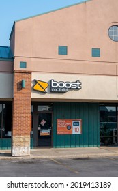 St. Joseph, MO United States Of America - August 2nd, 2021 : Boost Mobile Retail Location In Strip Mall.  Vertical Orientation Of Budget Brand Cell Service Provider.  Exterior With Signage Above Door.