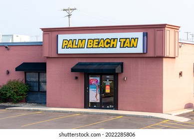 St. Joseph, MO United States Of America - August 2nd, 2021 : Exterior Store Front For Palm Beach Tan.  Main Entrance With Large Sign Above Door.  No People.