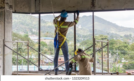  St Joseph, Trinidad & Tobago - March 15th 2018.

Construction worker on scaffolding with proper Person Protective Equipment (PPE) 