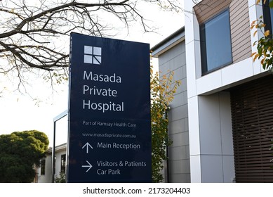 St Kilda East, Victoria, Australia - June 30 2022: Sign outside Masada Private Hospital, part of Ramsay Health Care, with trees and hospital buildings in the background