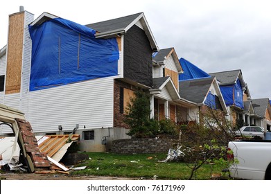 ST. LOUIS - APRIL 25, 2011: Blue tarps testify to tornado damage on house after house. The F3 twister swept through Maryland Heights in the suburbs of St. Louis on Good Friday, April 22, 2011.