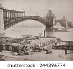 St. Louis Bridge under construction ca. 1870. The steel arches were cantilevered from opposing piers high above the river. The bridge