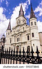 St. Louis Cathedral New Orleans And Iron Fence Outlined With Blue Sky And Clouds