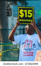 St. Louis, Missouri, US - October, 2016: A Unknown Person Holding A Sign For The Raise Of Minimum Wage At A Site For Protest Near Washington University For The 2016 Presidential Debate 