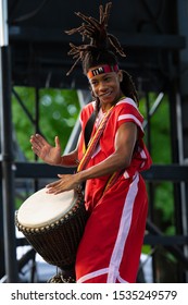 St. Louis, Missouri, USA - August 24, 2019: Festival Of Nations, Members Of The Sunshine Community Performance Ensemble, Wearing Traditional Clothing, Performing Music And Dances From West Africa