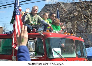 St. Louis, MO - 3/17/2019: Family Sitting On Top Of Fire Truck