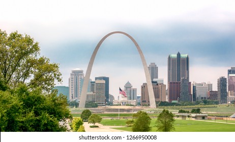 St. Louis skyline featuring the American flag under the Gateway Arch