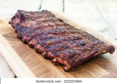 St Louis Style Grilled Rack Of Pork Ribs On Cutting Board