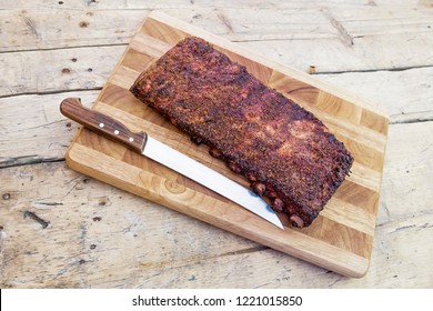 St Louis Style Grilled Rack Of Pork Ribs On Cutting Board