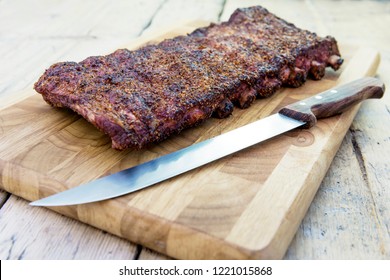 St Louis Style Grilled Rack Of Pork Ribs On Cutting Board