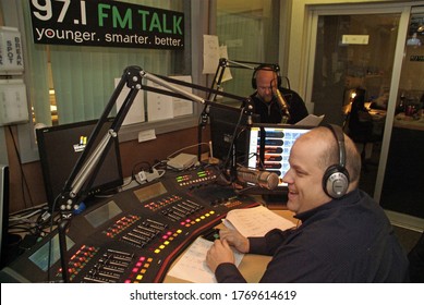 ST. LOUIS, UNITED STATES - Dec 07, 2007: Radio disc jockeys in a radio station studio in Missouri