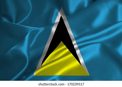 St. Lucia flag on satin texture.