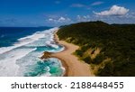 St Lucia South Africa, Rocks sand ocean, and blue coastal skyline at Mission Rocks beach near Cape Vidal in Isimangaliso Wetland Park in Zululand. South Africa St Lucia