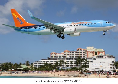 St. Maarten – February 9, 2014: Sunwing Boeing 737 Airplane At Princess Juliana International (SXM) Airport On St. Maarten.