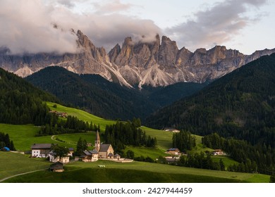 The St Magdalena Church with the Odle mountains range towering above it, Funes Valley, Dolomites, Italy