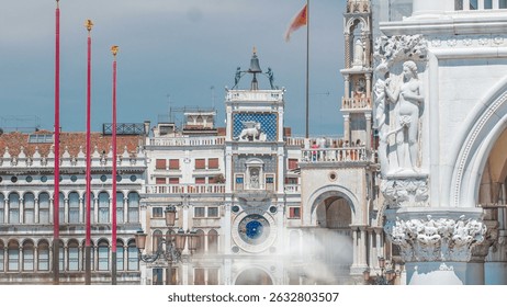 St Mark's Clock tower timelapse on Piazza San Marco, facade, Venice, Italy. Tourists on the square. On the facade of the tower is the astronomical clock. At the top is a bell and Moors figures