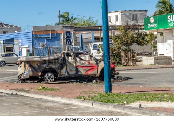 St Martin, December 2019: Protesters burn vehicles\
to block the main road on french Saint Martin. The Main protest is\
against The PPRN not allowing locals to rebuild homes after\
hurricane Irma.