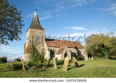 St Mary in the Marsh is an Anglican Church in New Romney - Kent. It has a traditional clock tower and spire which was added in the 15th century.