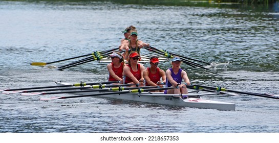 ST NEOTS, CAMBRIDGESHIRE, ENGLAND - JULY 23, 2022: Ladies Sculling Fours Race Two Teams Very Close Together.